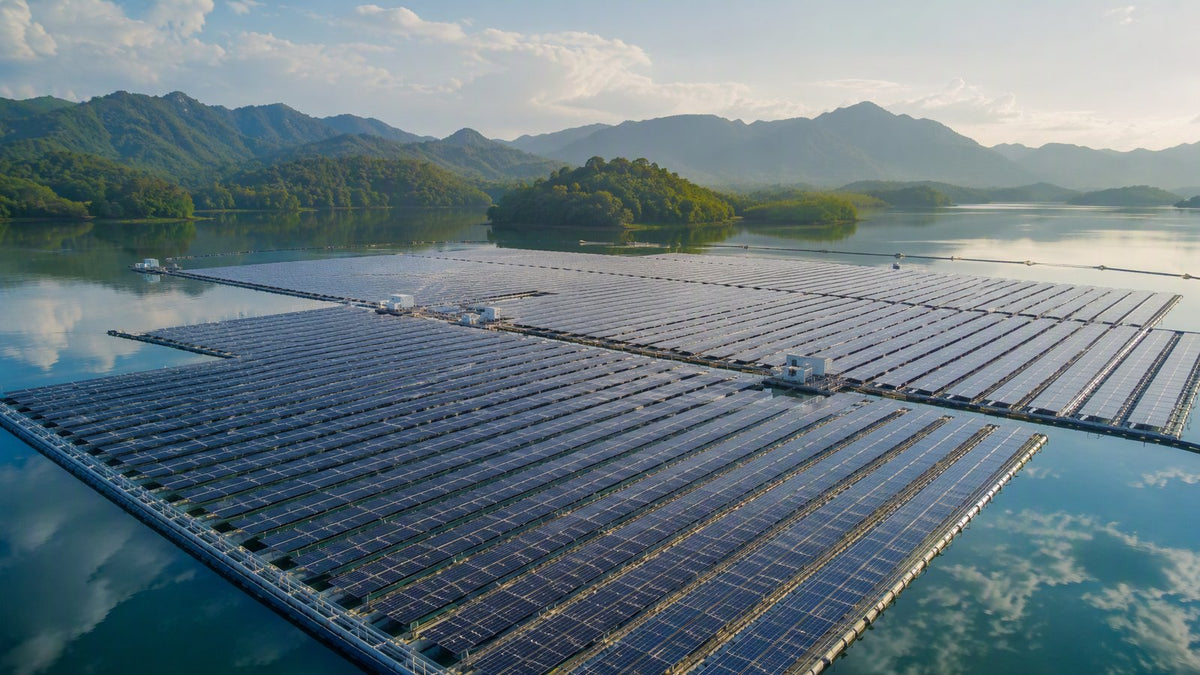 A vast floating solar farm on a calm reservoir
