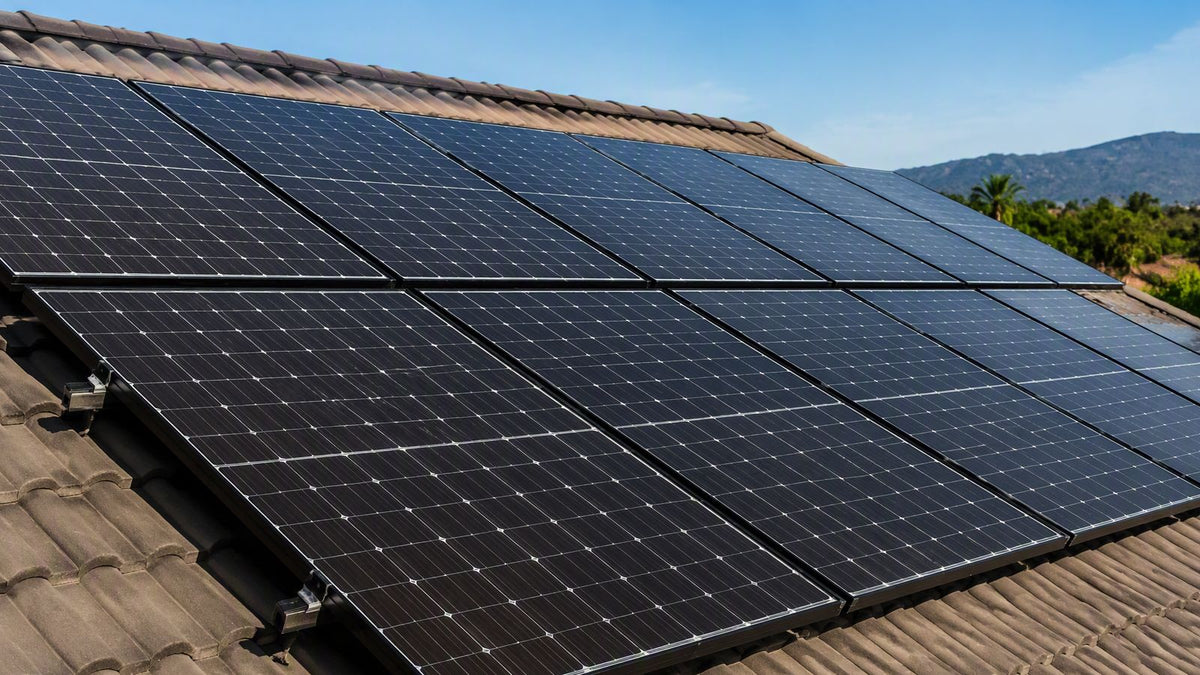 A neat row of black residential solar panels on a rooftop