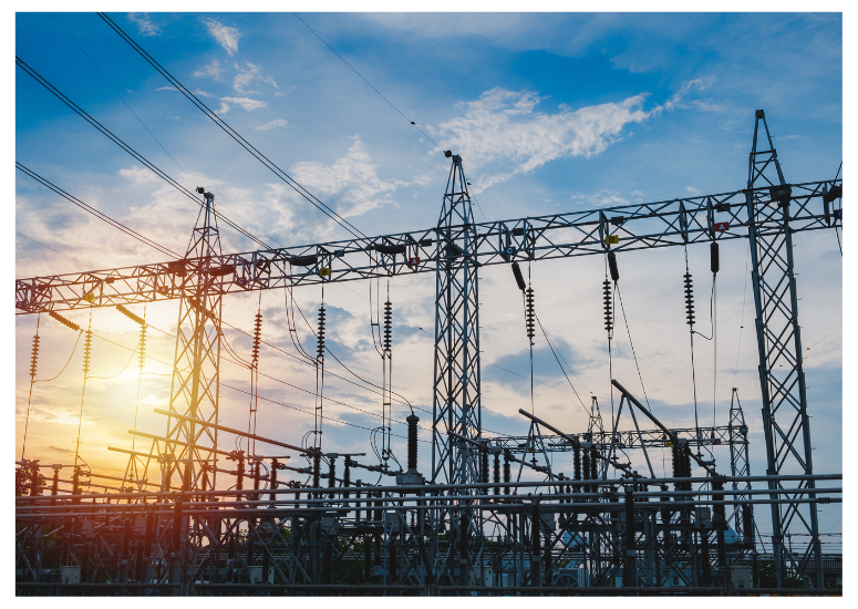 Power transmission lines with a sunset in the background